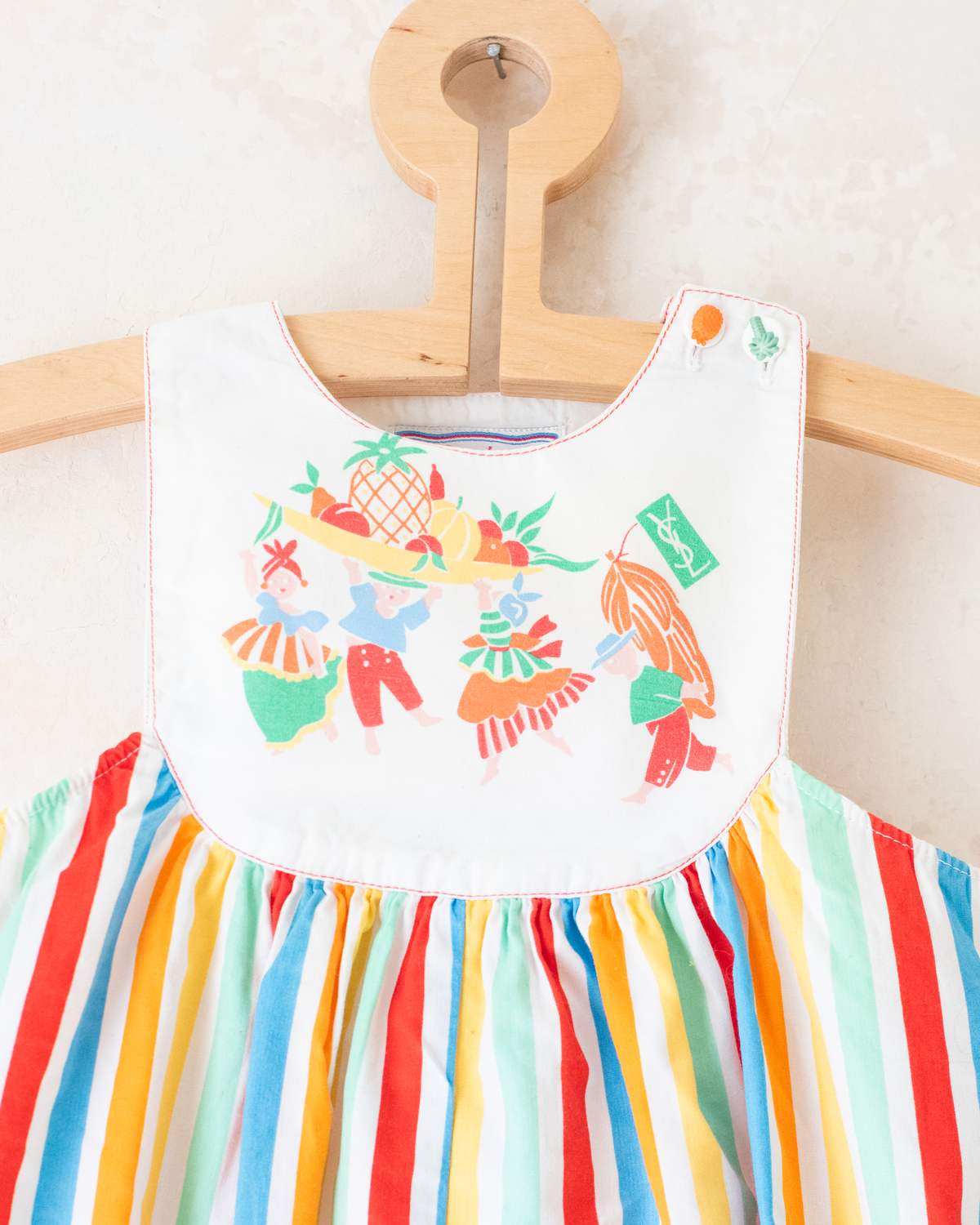 Colorful fruit-print jumpsuit by Yves Saint Laurent | 9-12 months