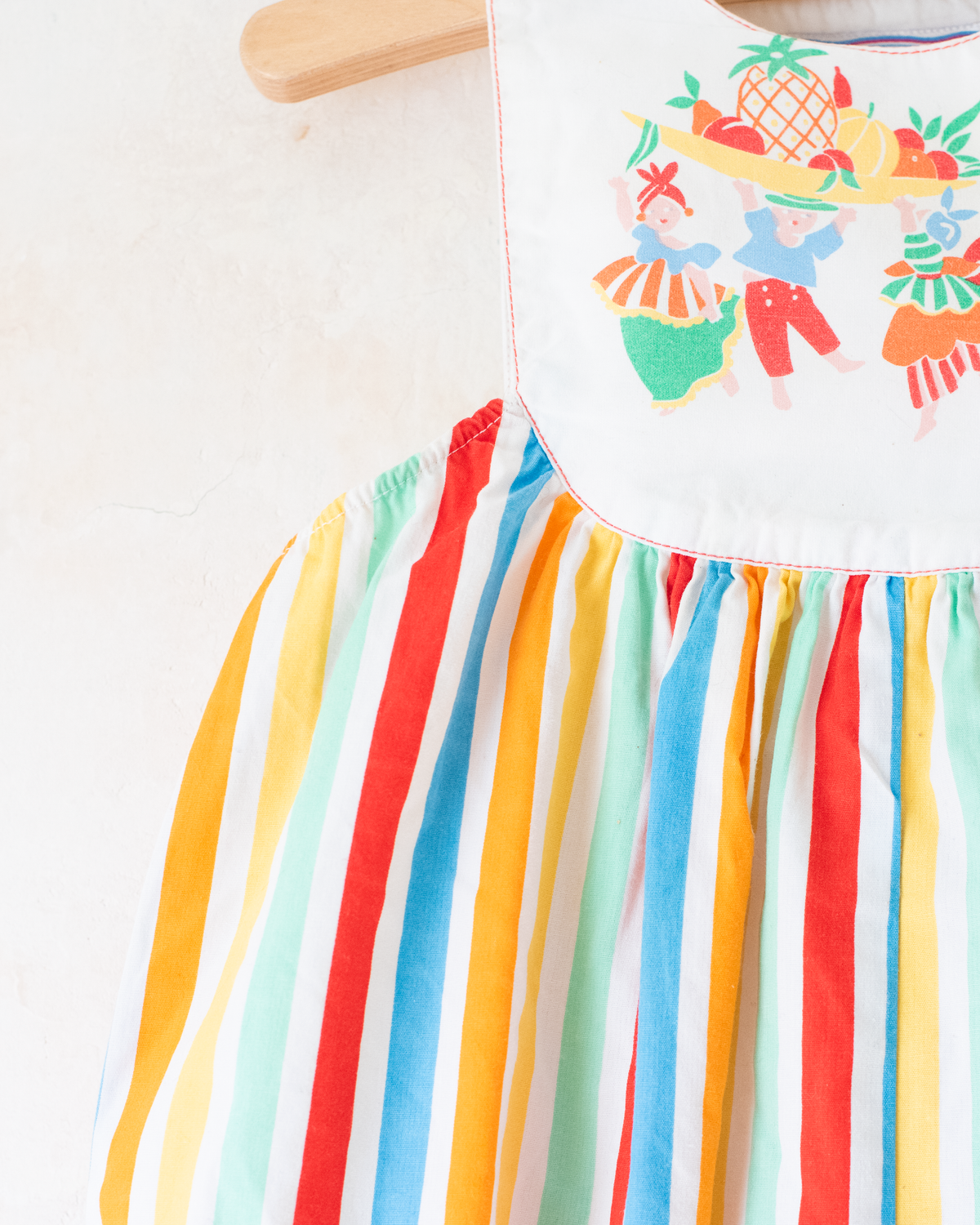 Colorful fruit-print jumpsuit by Yves Saint Laurent | 9-12 months