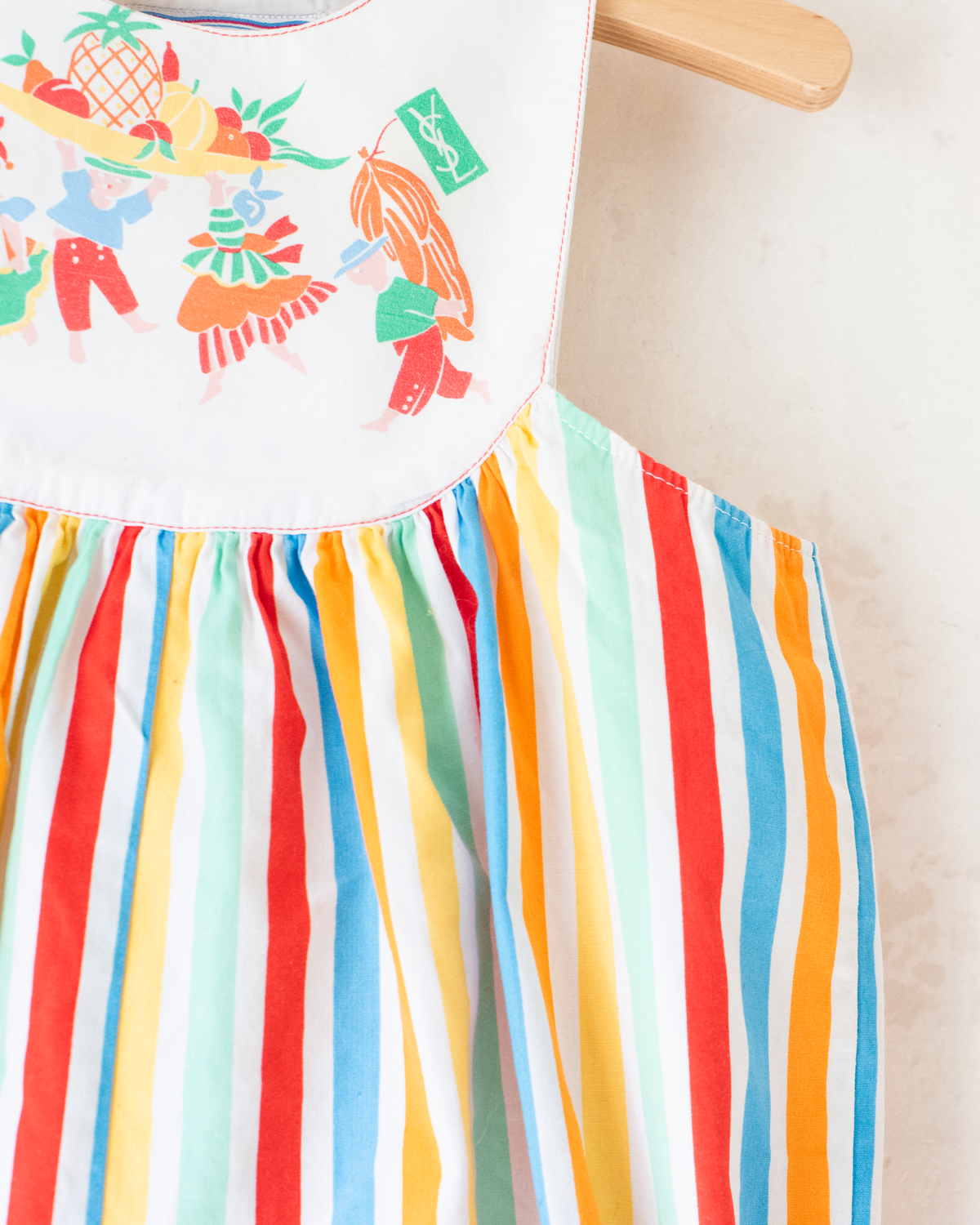 Colorful fruit-print jumpsuit by Yves Saint Laurent | 9-12 months