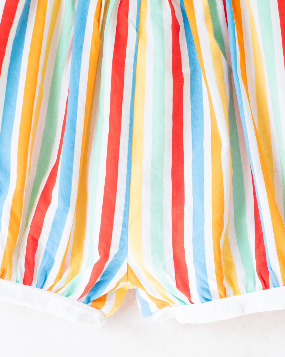 Colorful fruit-print jumpsuit by Yves Saint Laurent | 9-12 months