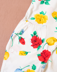 אוברול לבן מהניינטיז עם פרחים צבעוניים | 6-9 חודשים