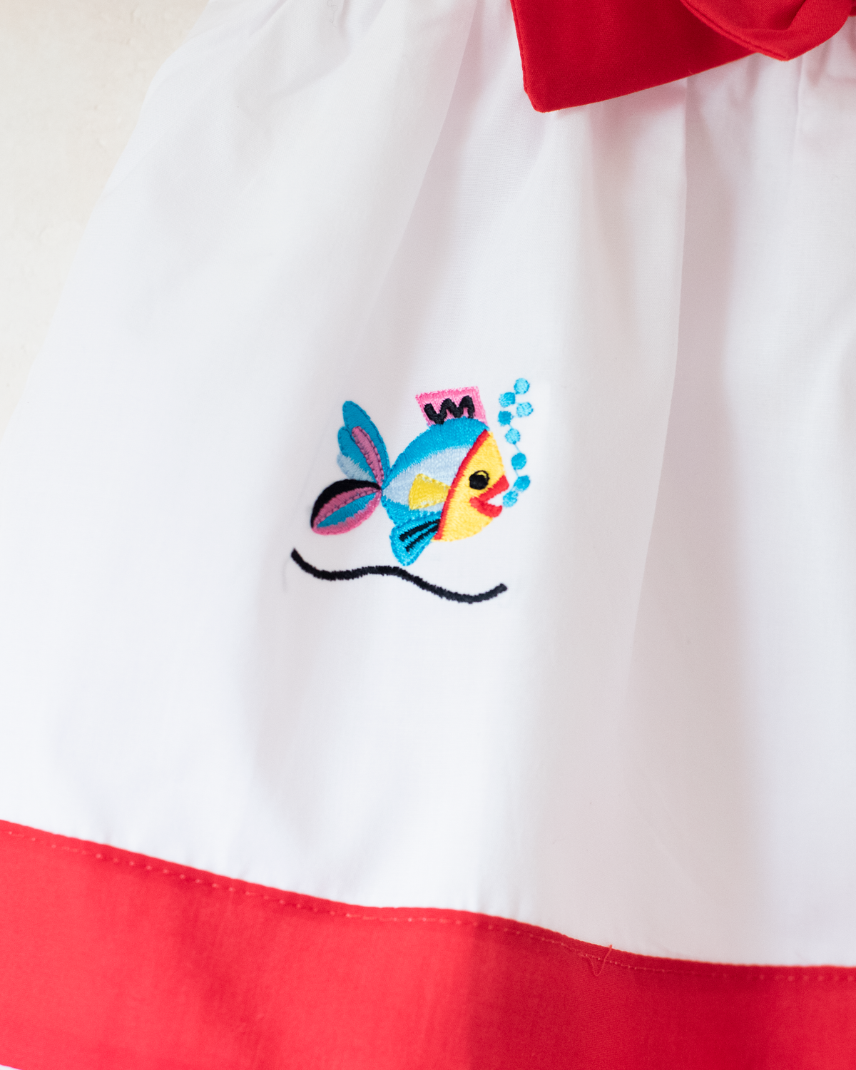 White sailor dress with embroidered fish | 9-12 months