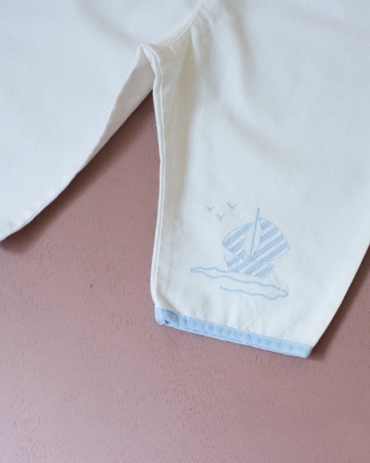 White sailor overalls with a boat embroidered on the leg | 9-12 months
