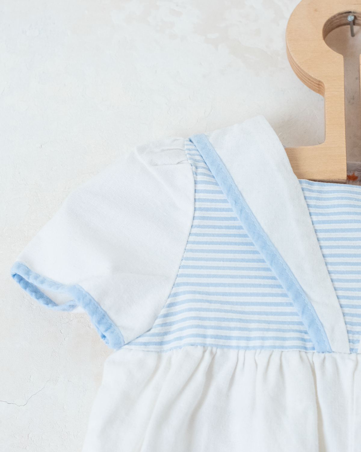 White sailor overalls with a boat embroidered on the leg | 9-12 months