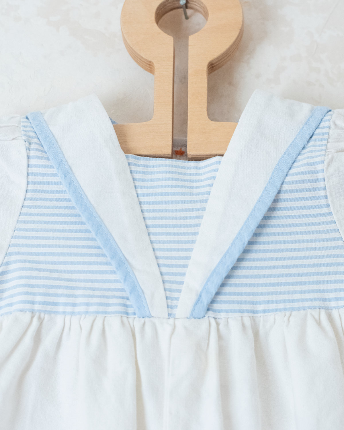 White sailor overalls with a boat embroidered on the leg | 9-12 months