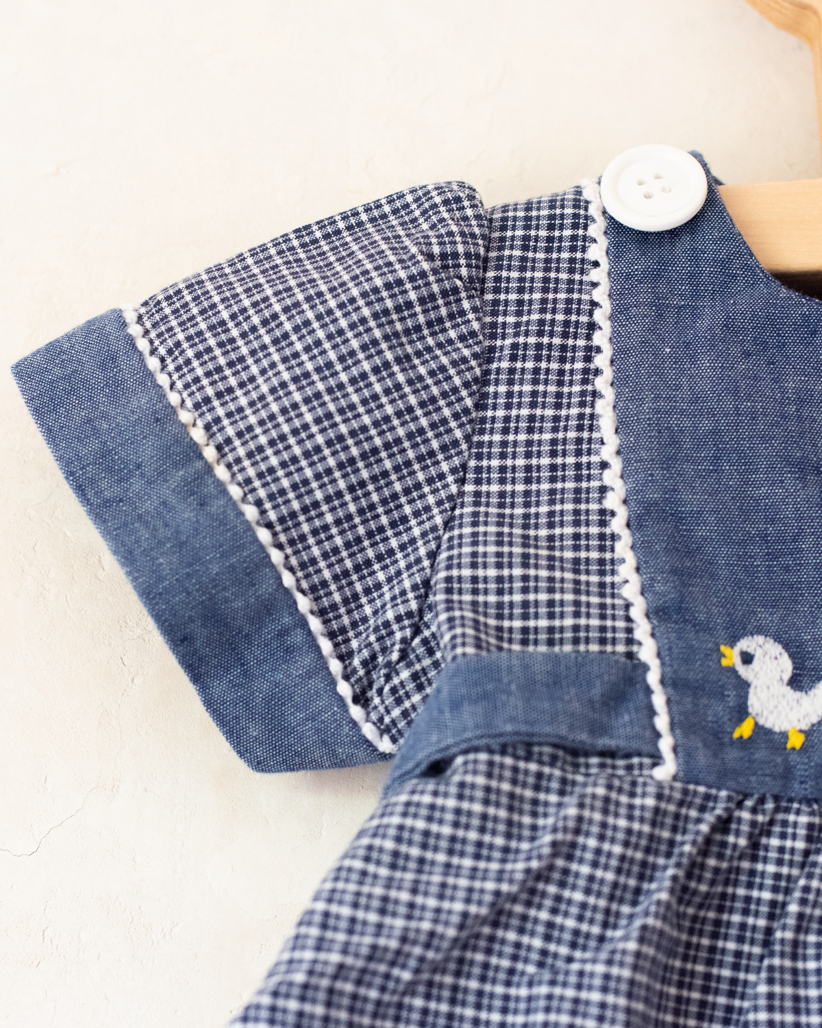 Blue plaid dress with embroidery of a girl and two ducks | 3-6 months