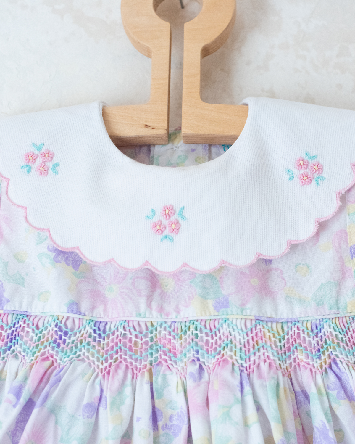 Bright floral jumpsuit with embroidered collar | 9-12 months
