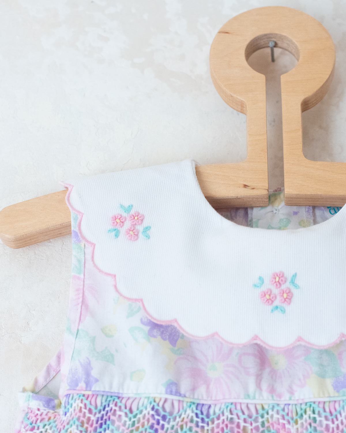 Bright floral jumpsuit with embroidered collar | 9-12 months