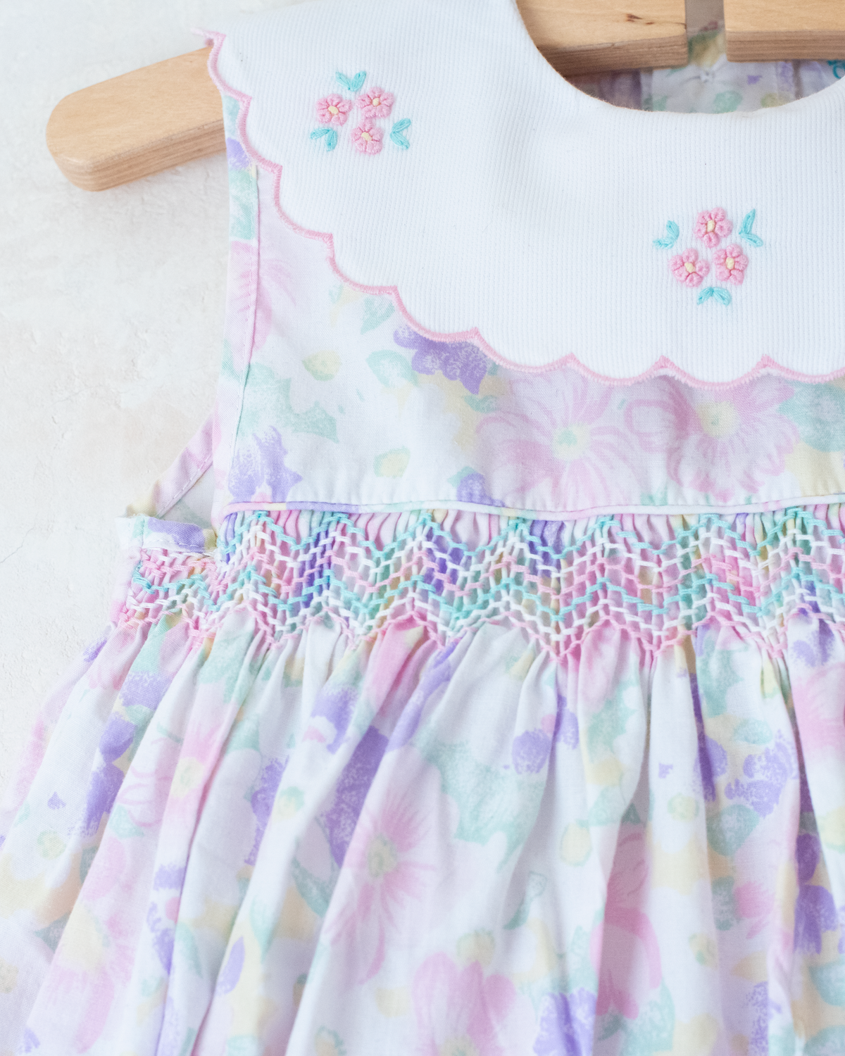 Bright floral jumpsuit with embroidered collar | 9-12 months