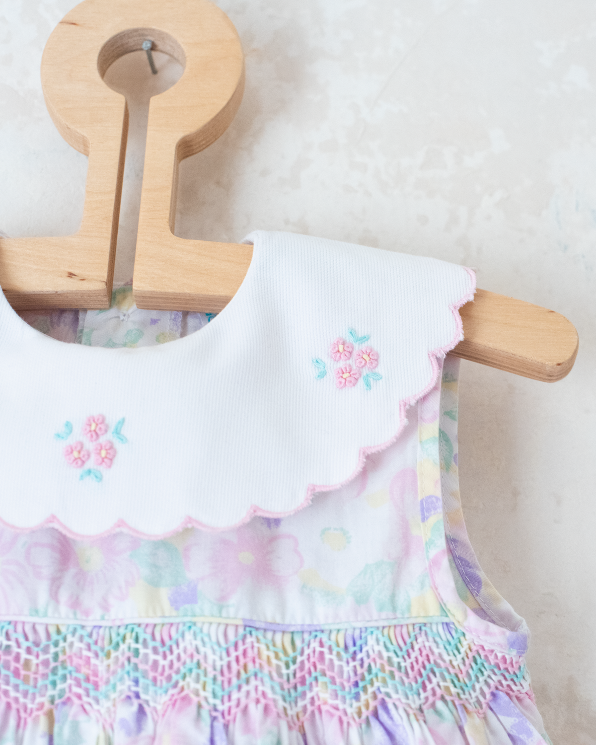 Bright floral jumpsuit with embroidered collar | 9-12 months