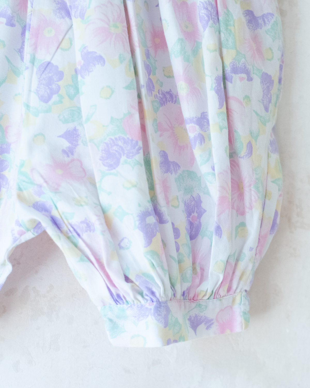 Bright floral jumpsuit with embroidered collar | 9-12 months