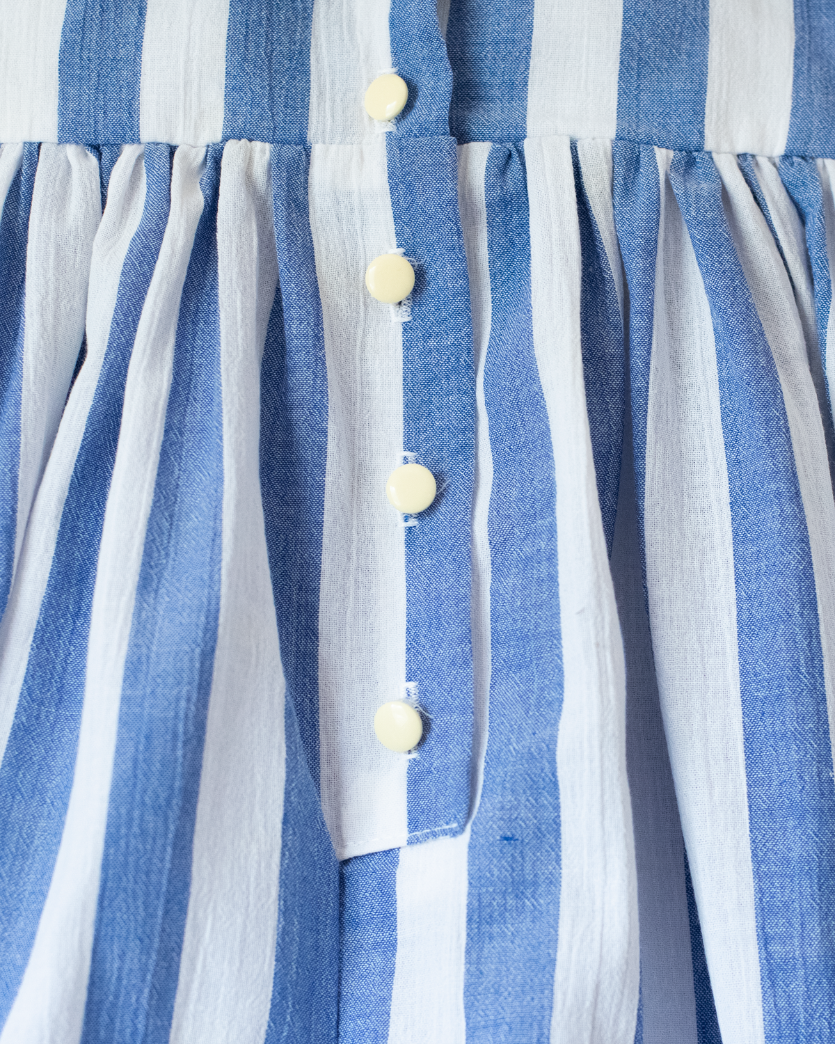 Striped jumpsuit with embroidered boats | 9-12 months
