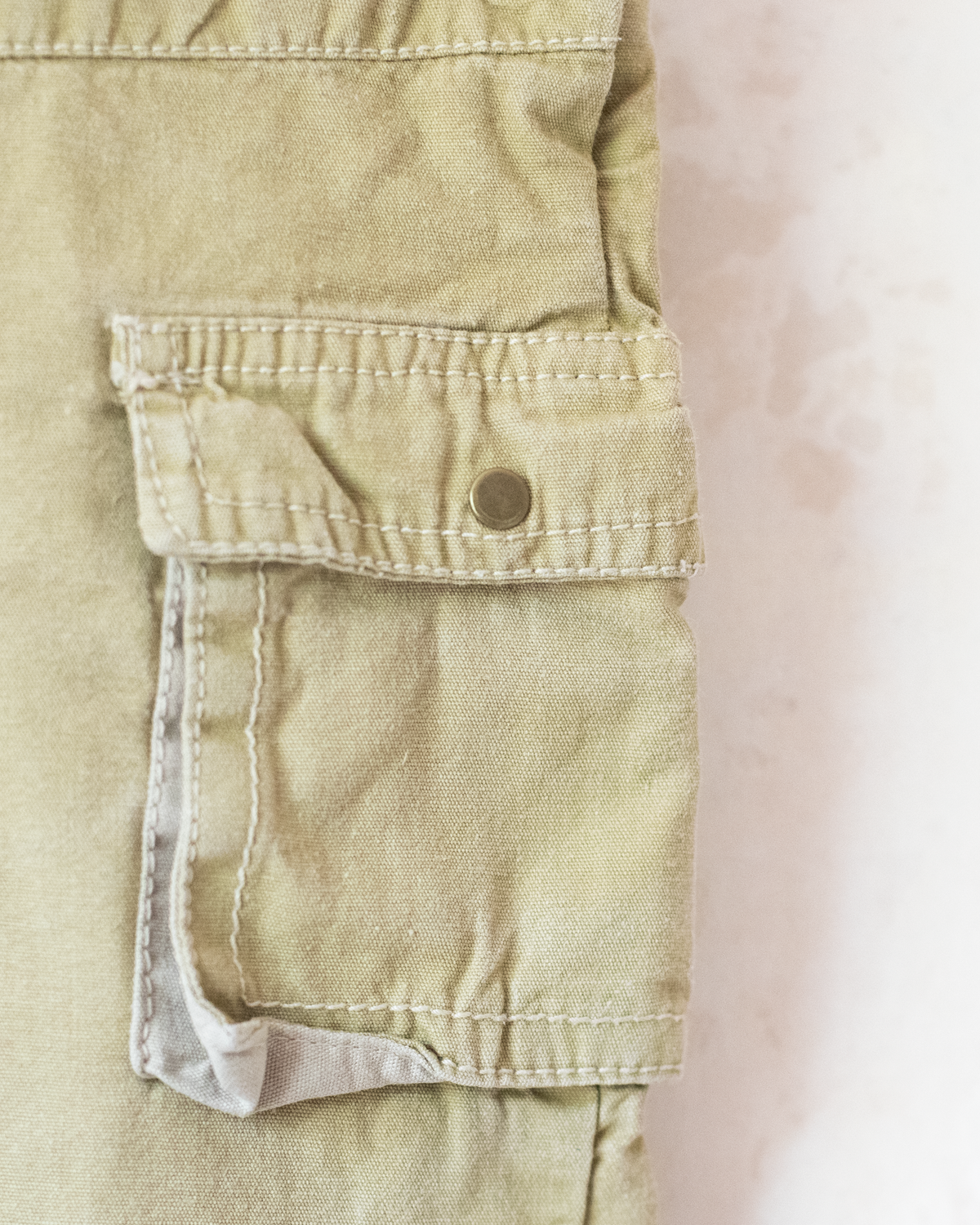 Olive-colored overalls with a Babar the King embroidery | 12-18 months