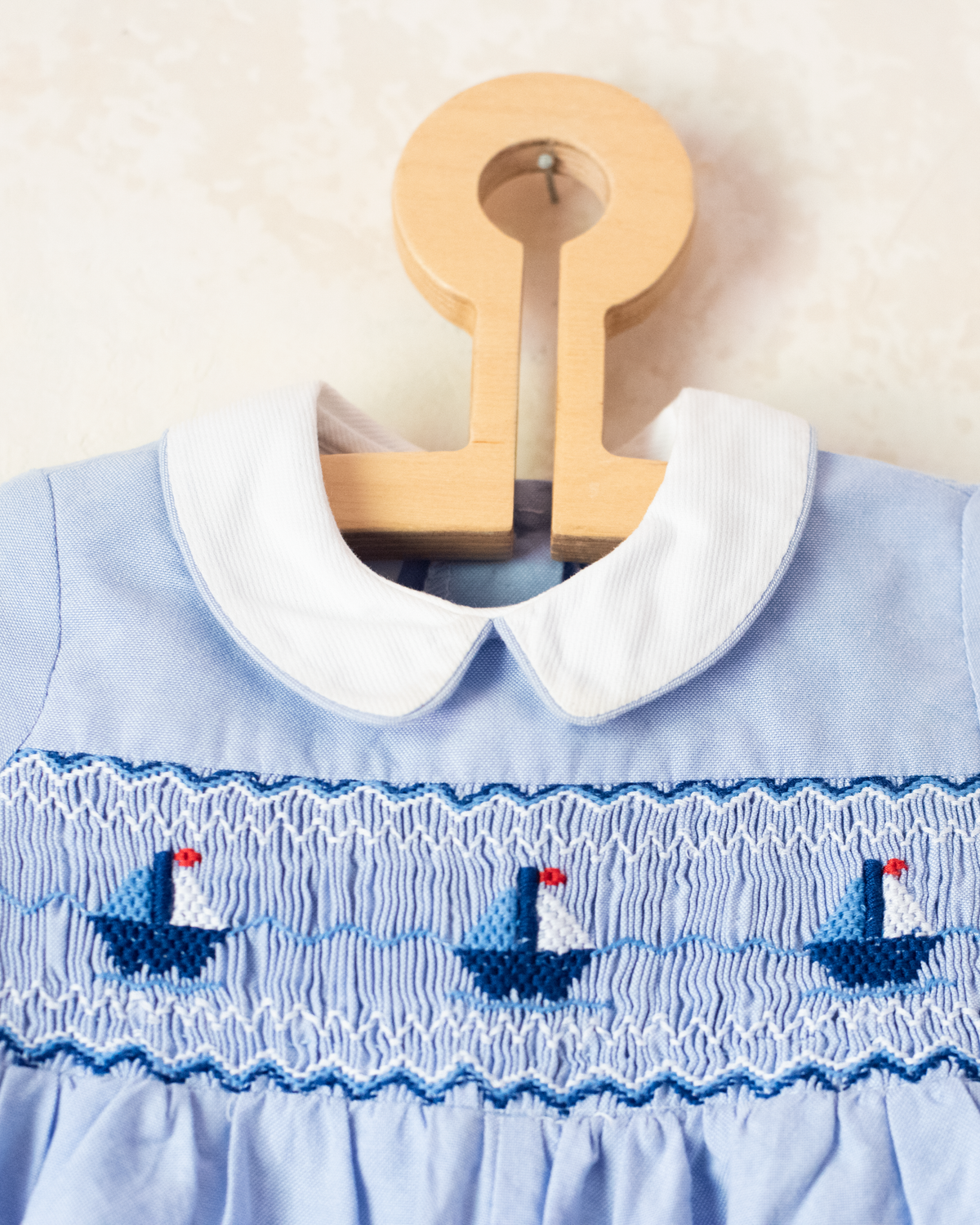 Sky blue overalls with embroidered boats | 12-18 months