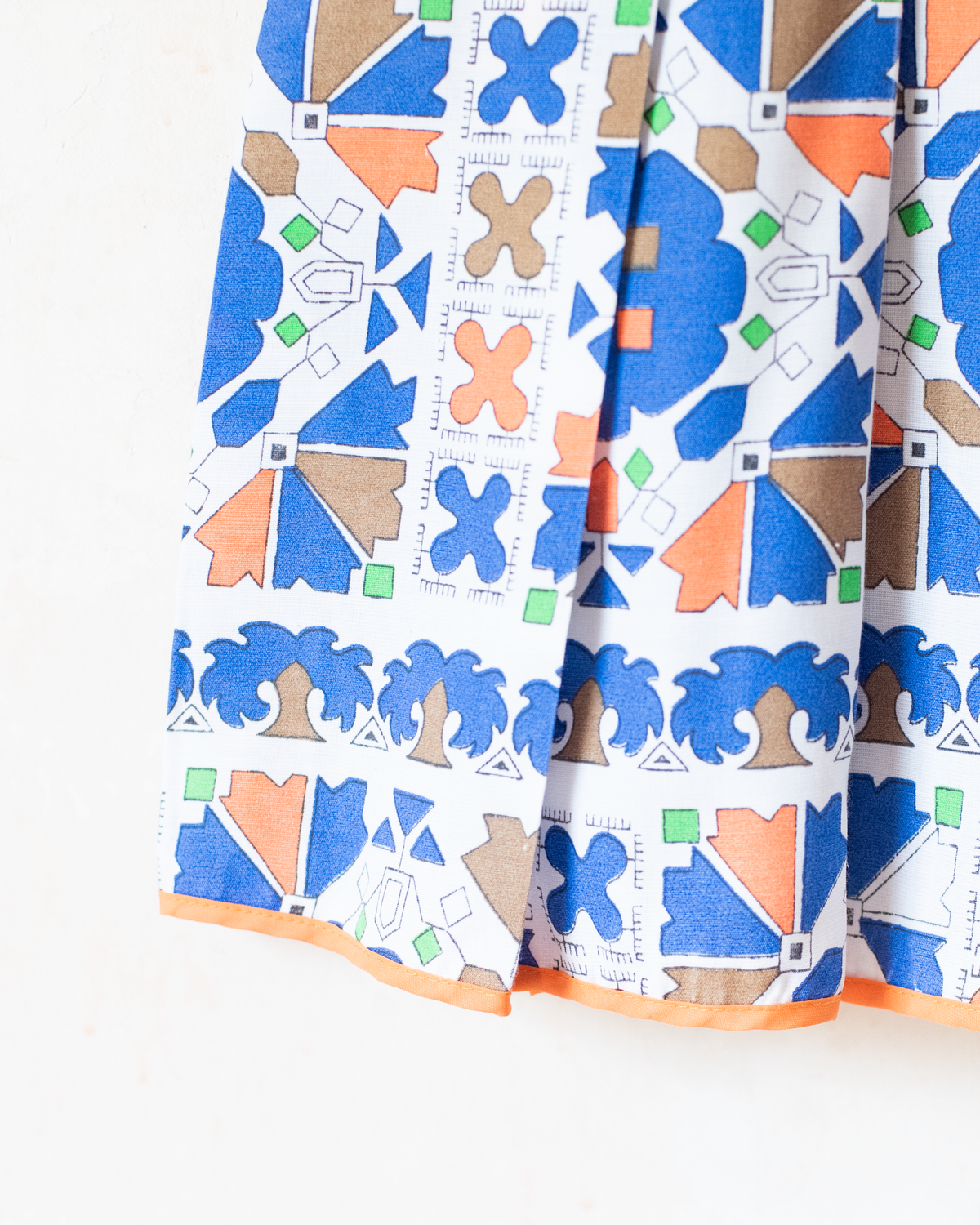 Colorful dress with shapes and pleats | 4-5 years
