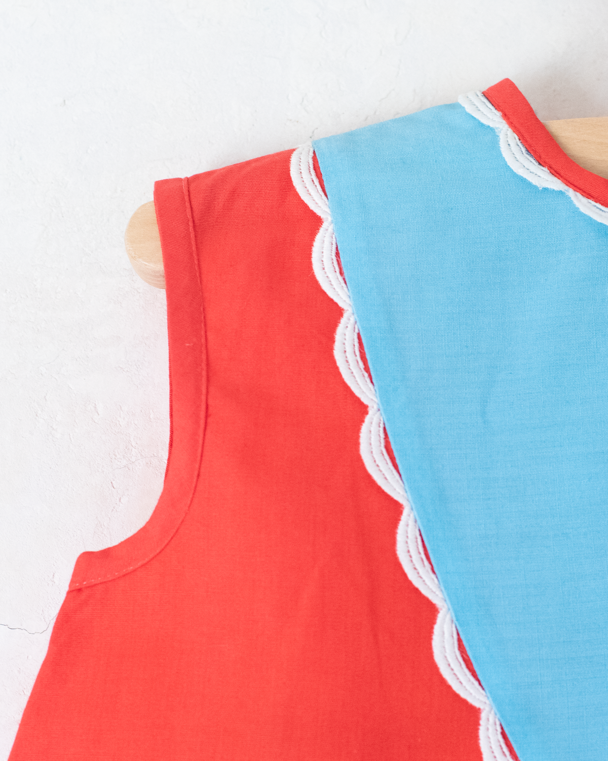 Red and light blue dress with embroidered children | 9-12 months