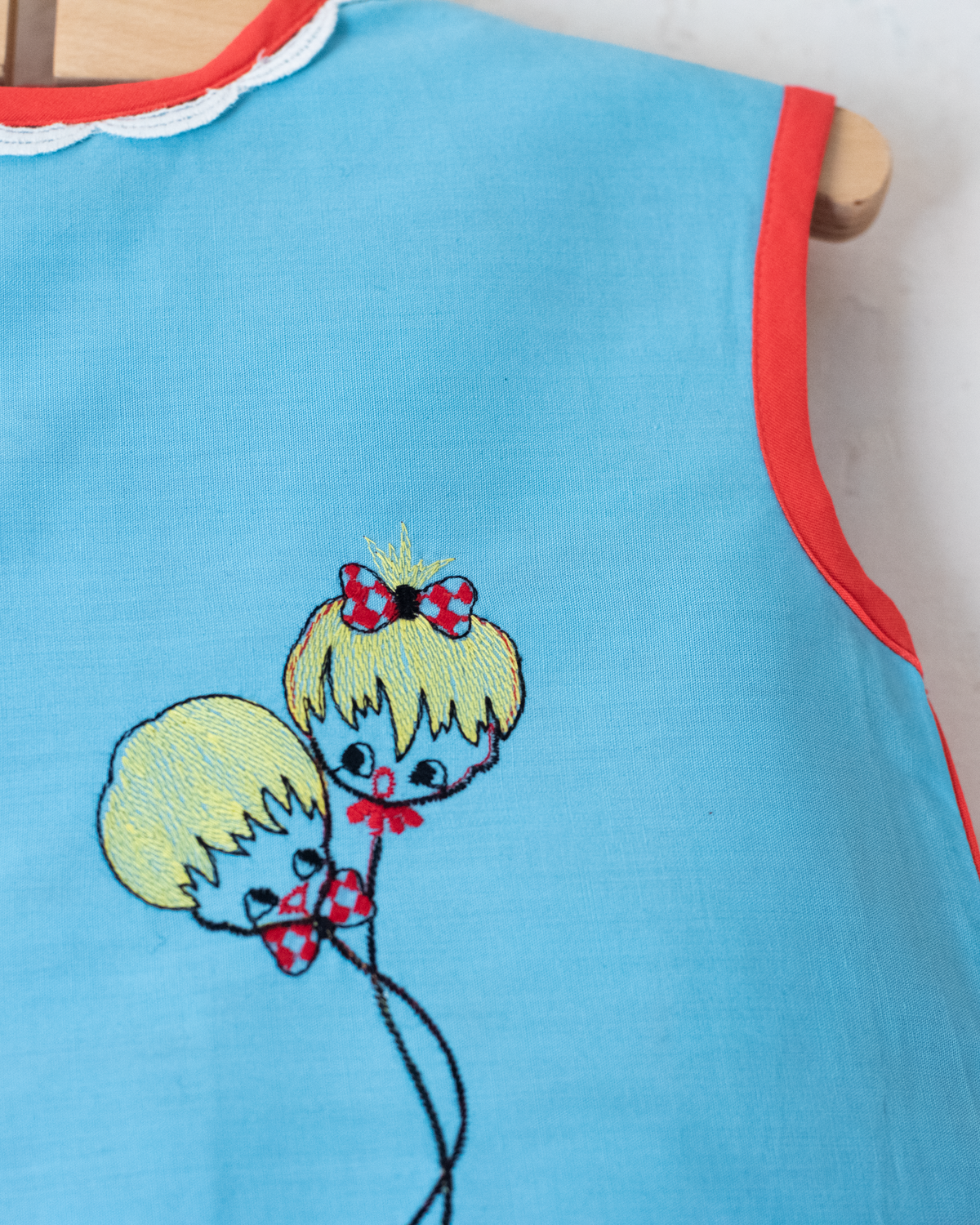 Red and light blue dress with embroidered children | 9-12 months