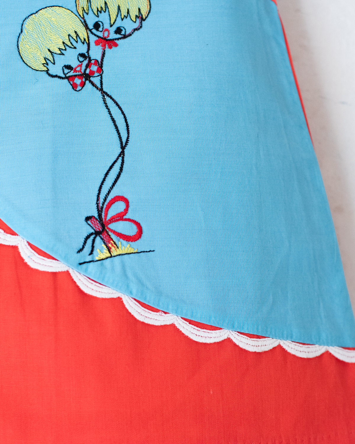 Red and light blue dress with embroidered children | 9-12 months
