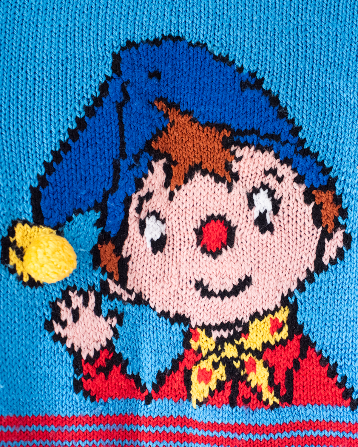 Blue sweater with a figure of a dwarf and a yellow pom-pom | 5-6 years