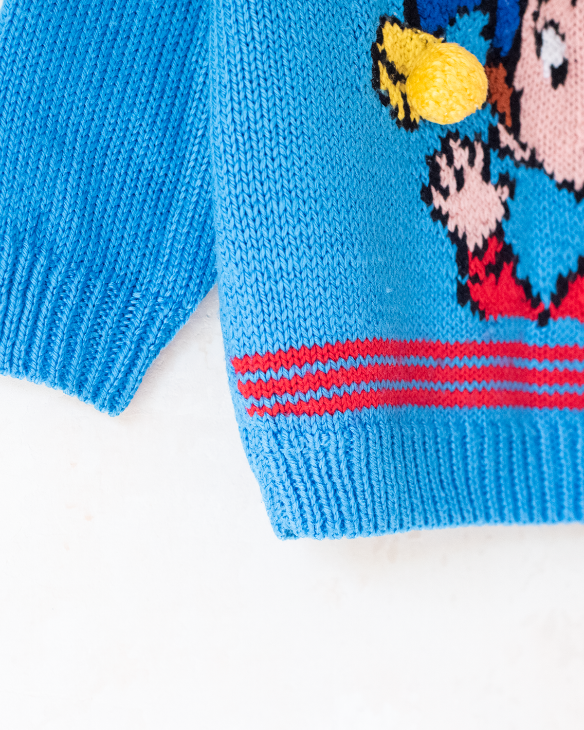 Blue sweater with a figure of a dwarf and a yellow pom-pom | 5-6 years