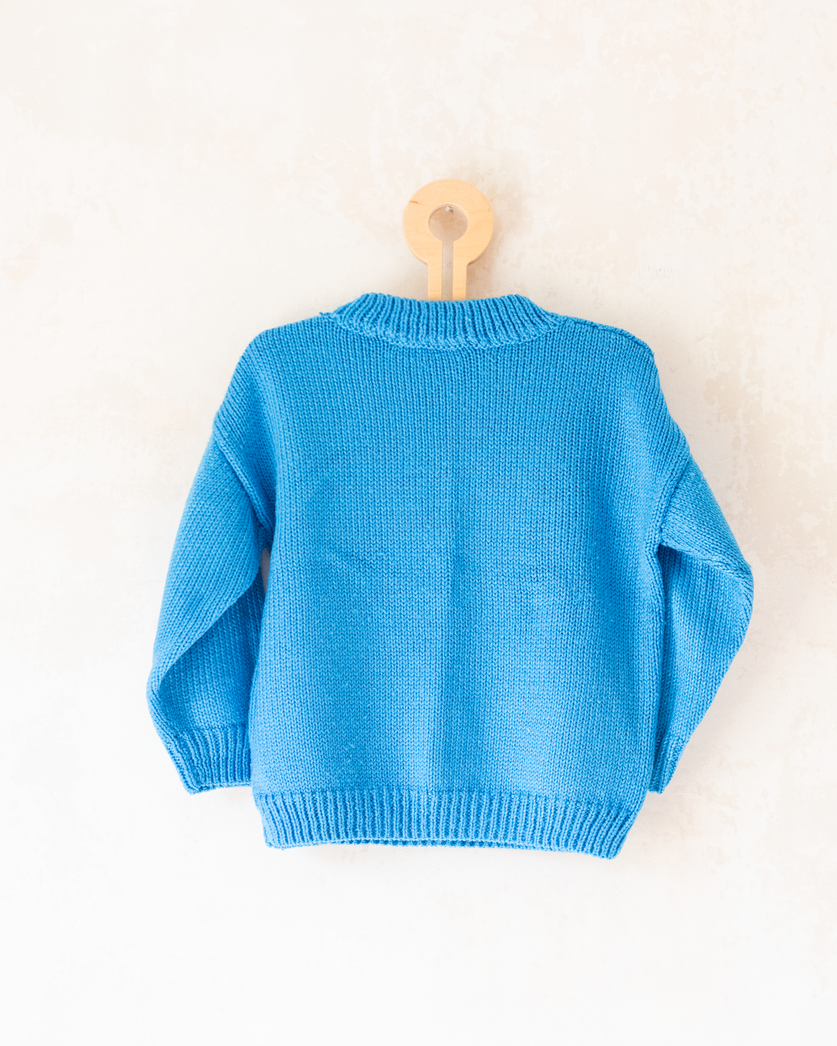 Blue sweater with a figure of a dwarf and a yellow pom-pom | 5-6 years