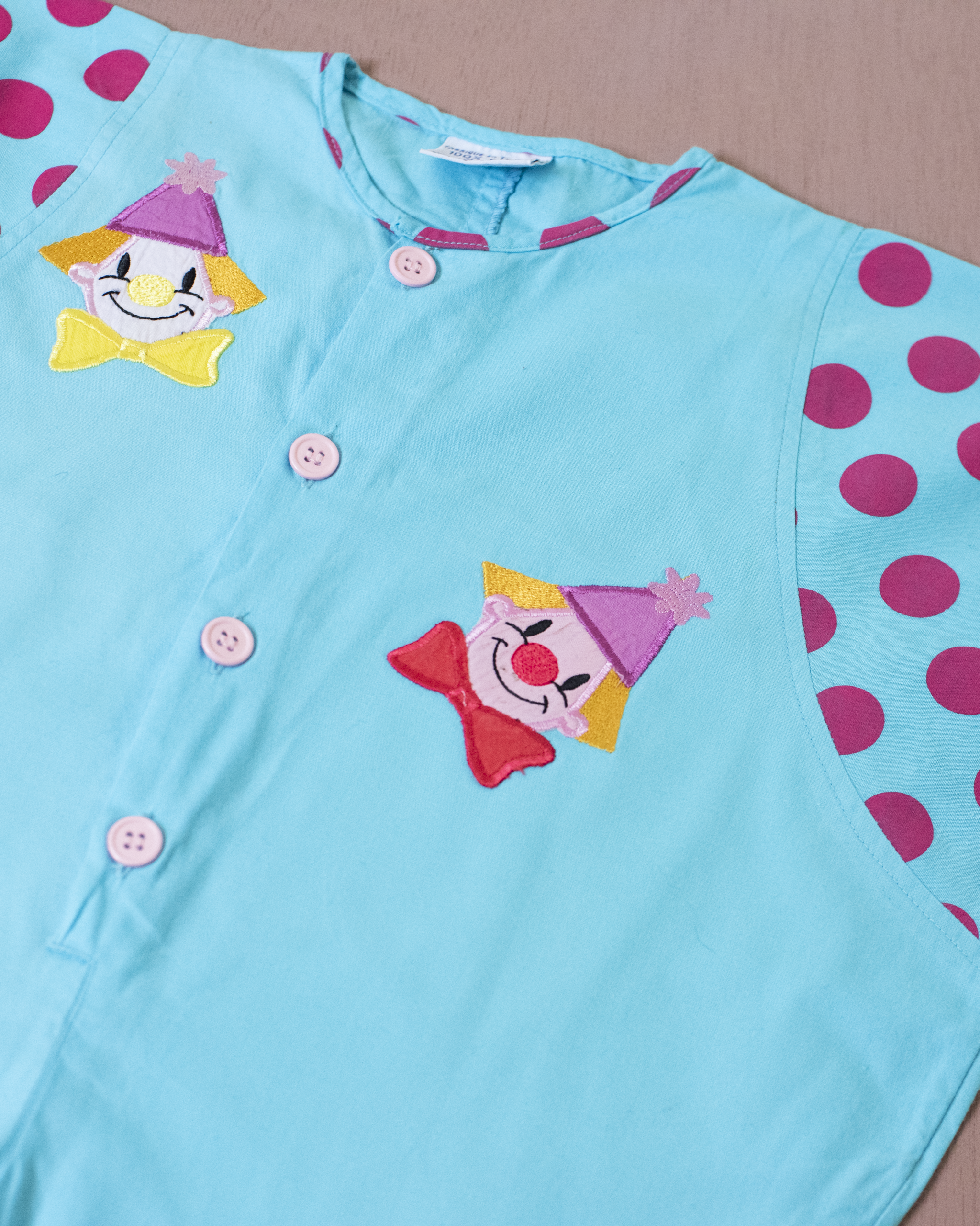 אוברול תכלת עם נקודות וליצנים | 12-18 חודשים