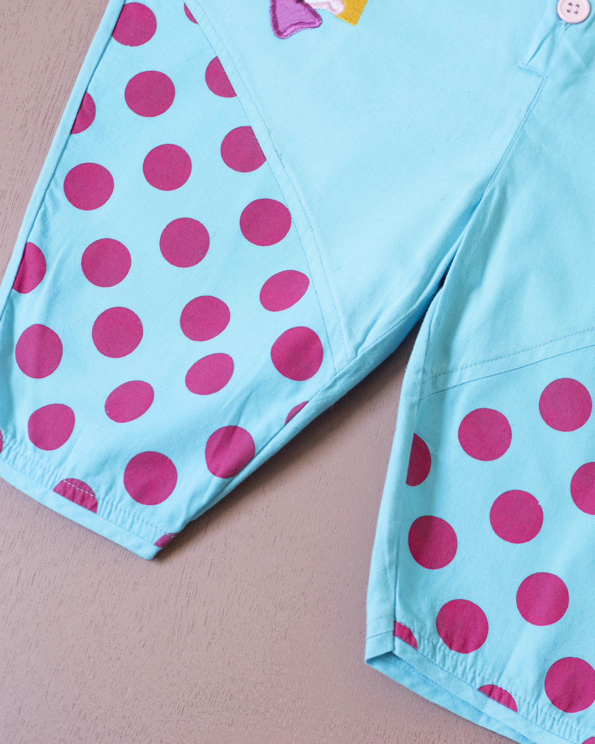 אוברול תכלת עם נקודות וליצנים | 12-18 חודשים