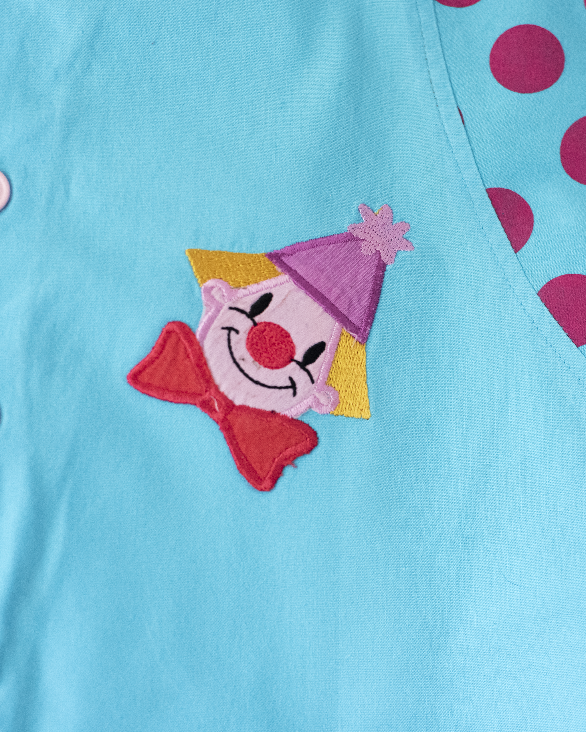 אוברול תכלת עם נקודות וליצנים | 12-18 חודשים