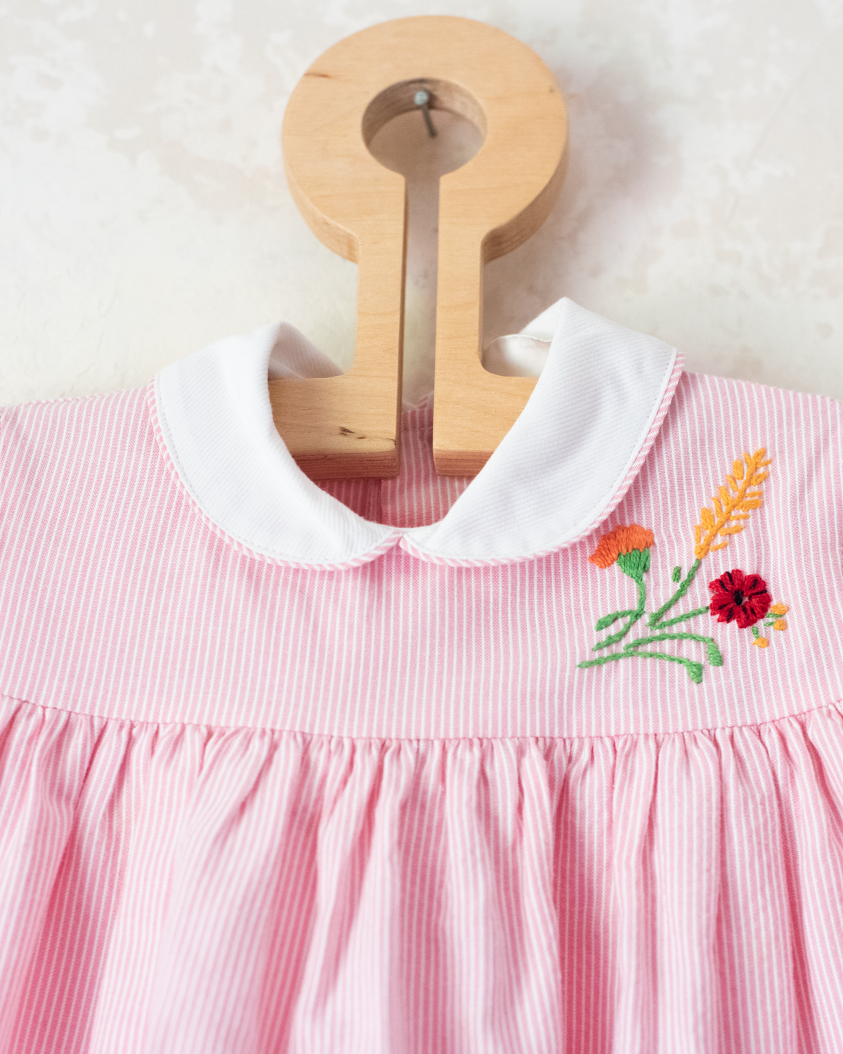 Pink striped dress with flower and cornflower embroidery | 9-12 months