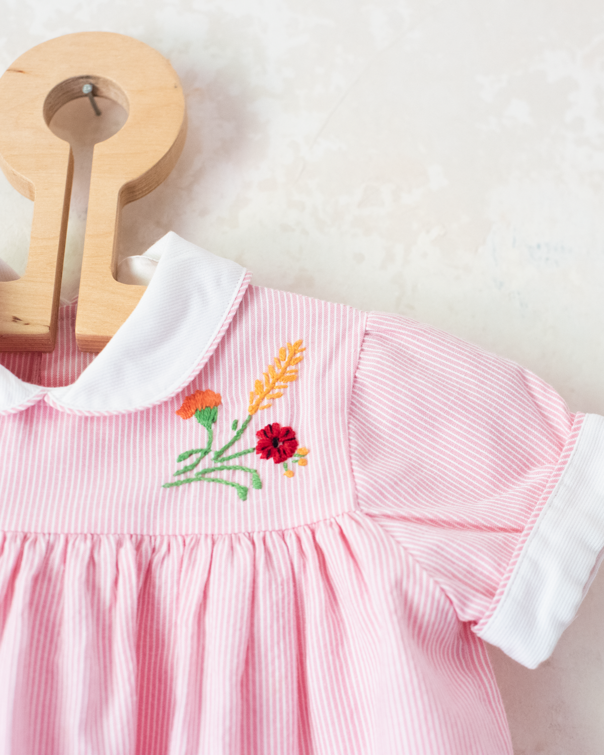 Pink striped dress with flower and cornflower embroidery | 9-12 months