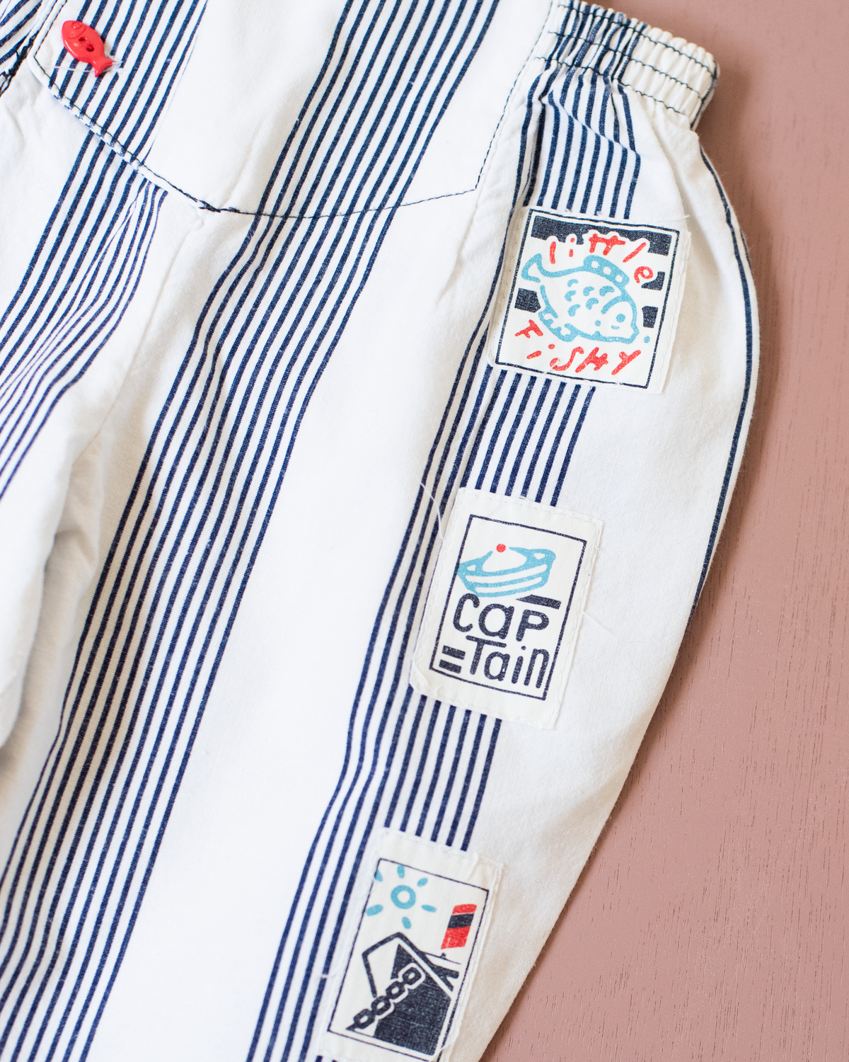 Striped jumpsuit with fish buttons | 12-18 months