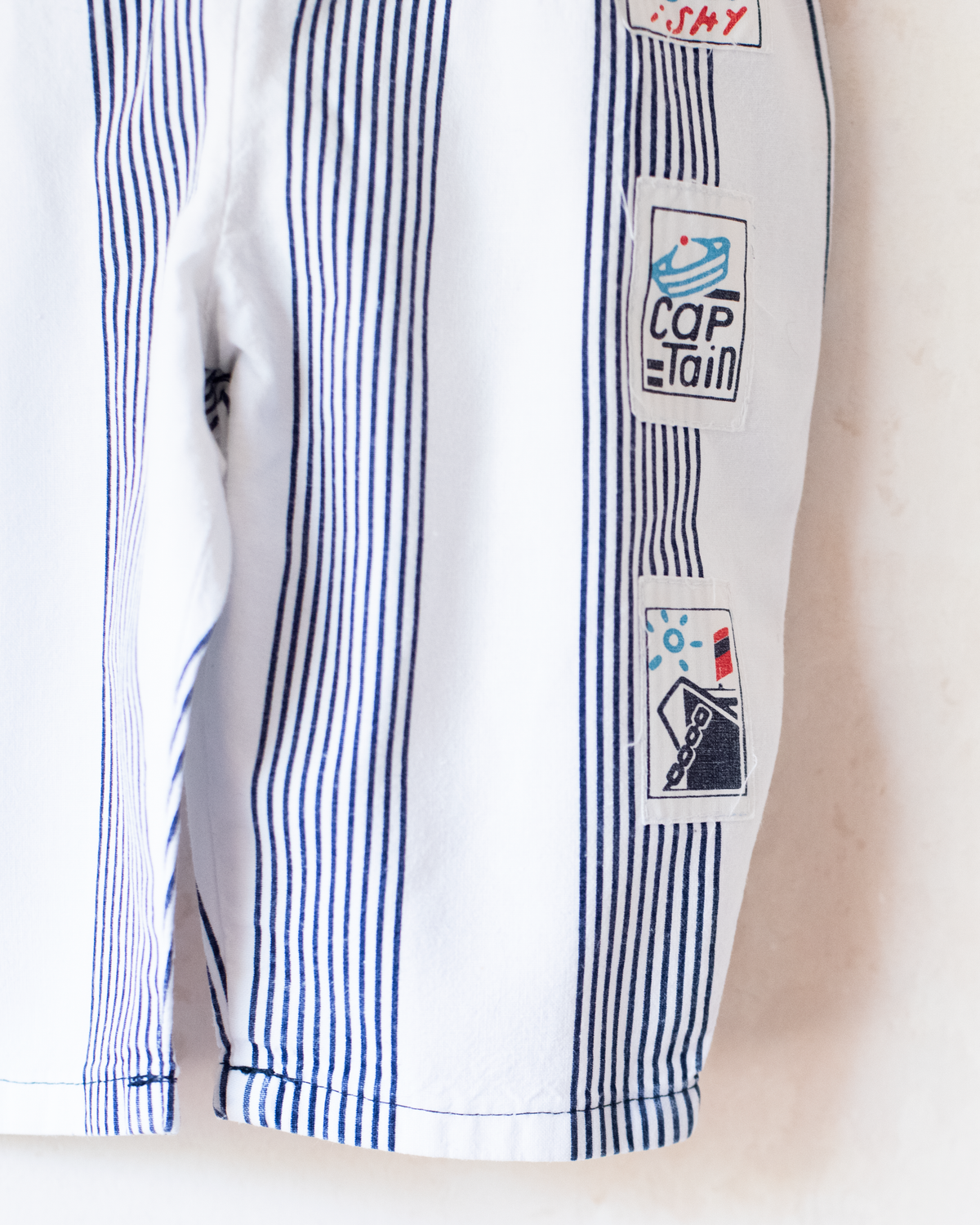 Striped jumpsuit with fish buttons | 12-18 months