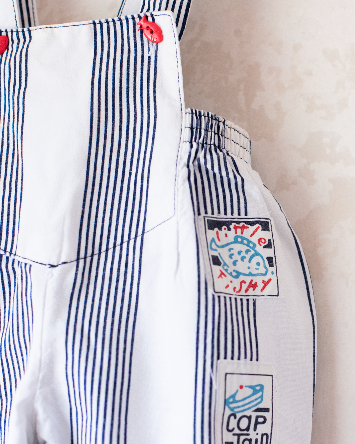 Striped jumpsuit with fish buttons | 12-18 months