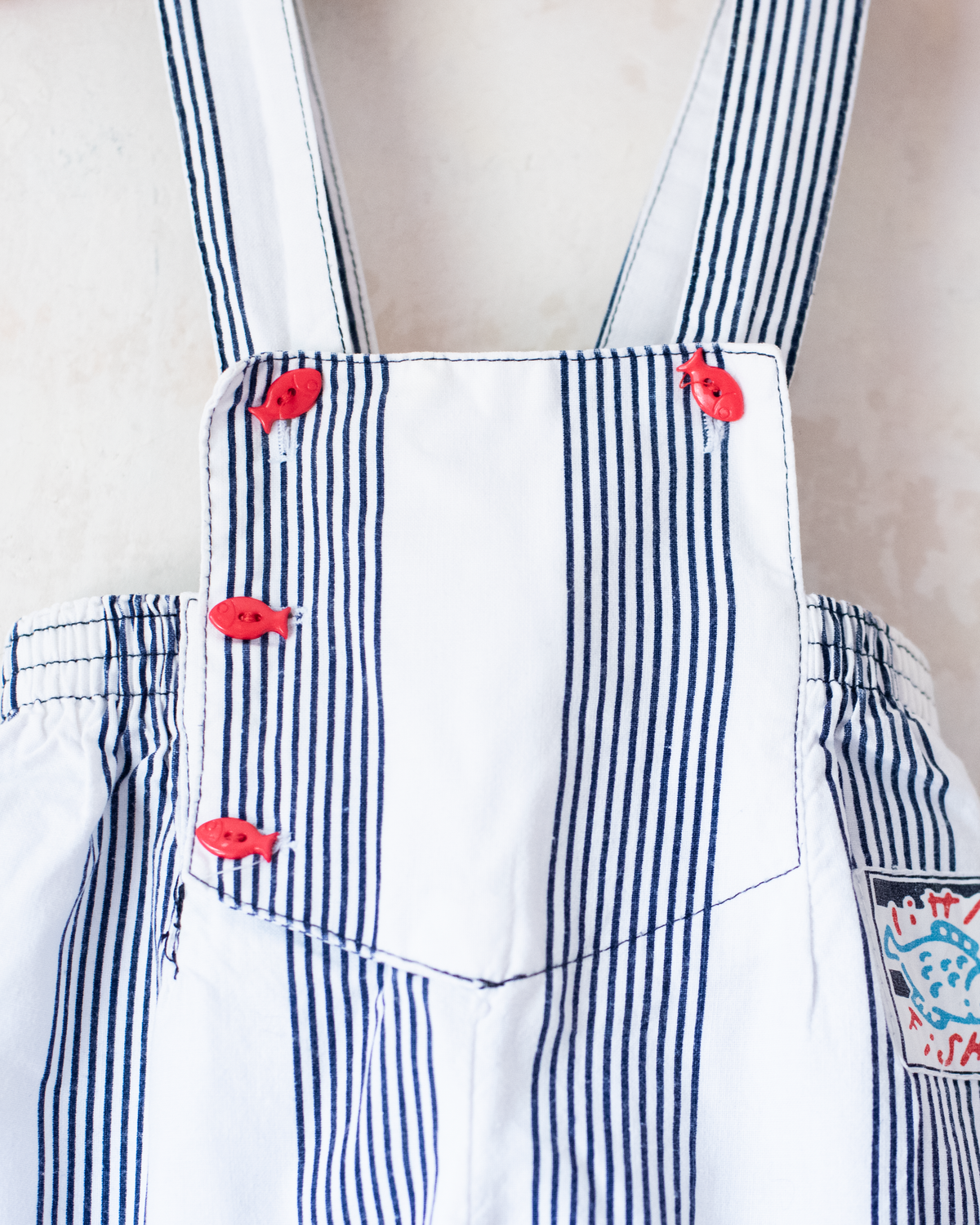 Striped jumpsuit with fish buttons | 12-18 months