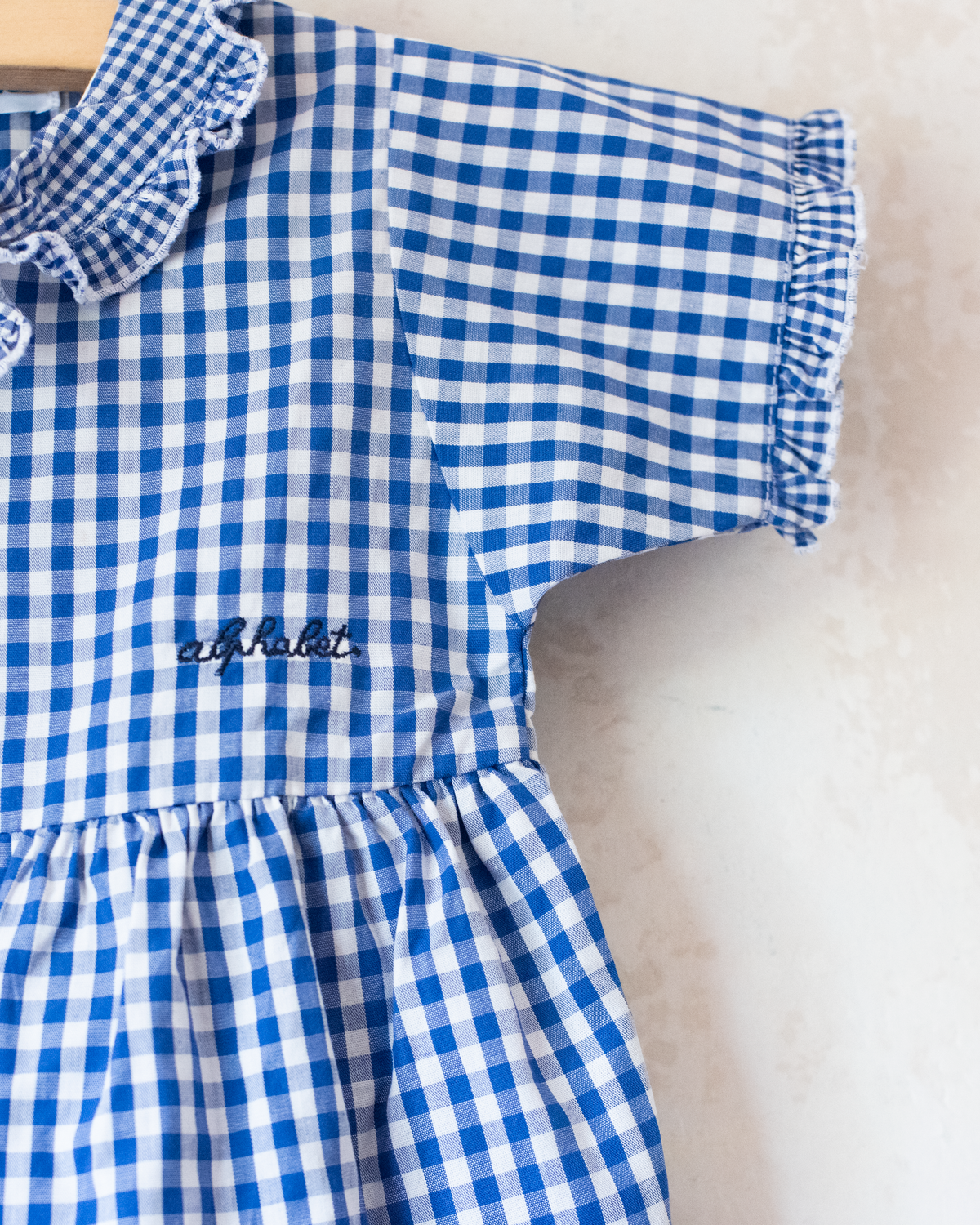 Checked overall with a sailor collar | 12-18 months