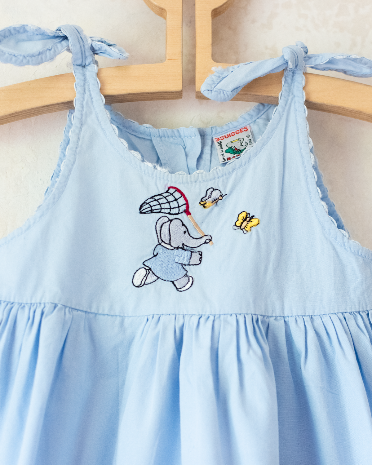 Light-blue dress with embroideries of King Babar and butterflies | 12-18 months