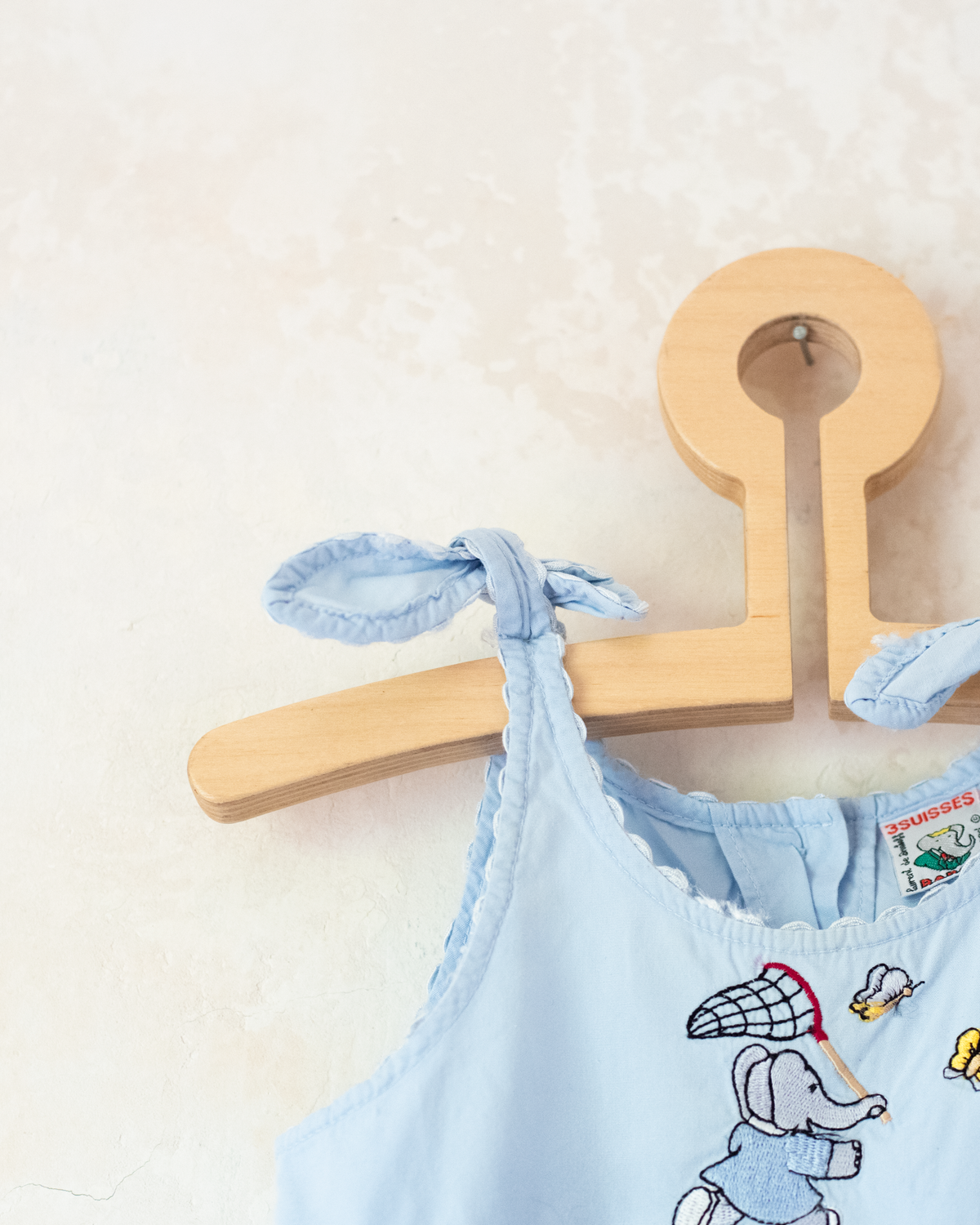Light-blue dress with embroideries of King Babar and butterflies | 12-18 months