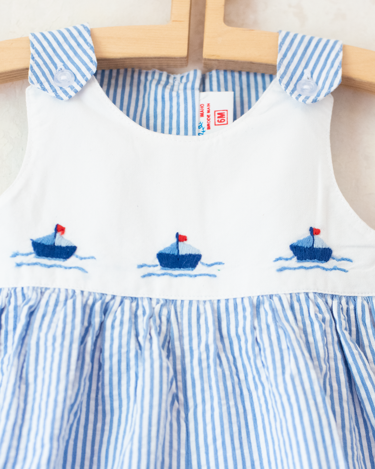Striped romper with embroidered boats | 3-6 months
