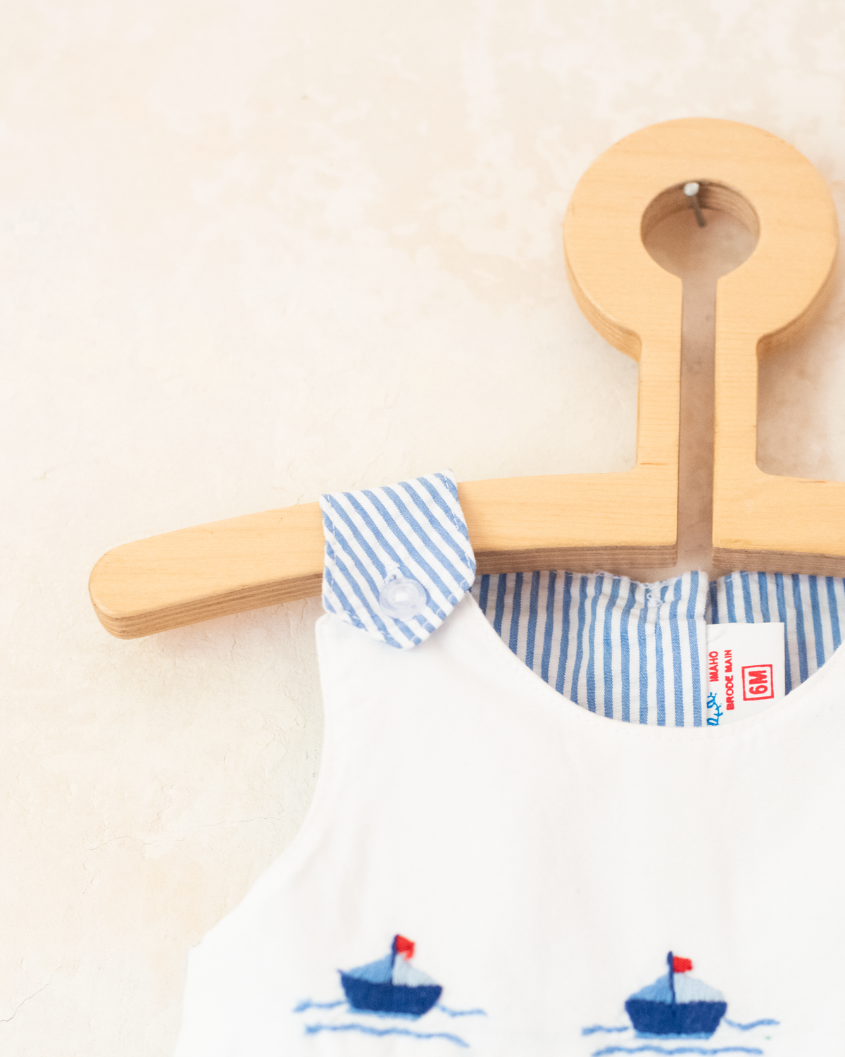 Striped romper with embroidered boats | 3-6 months