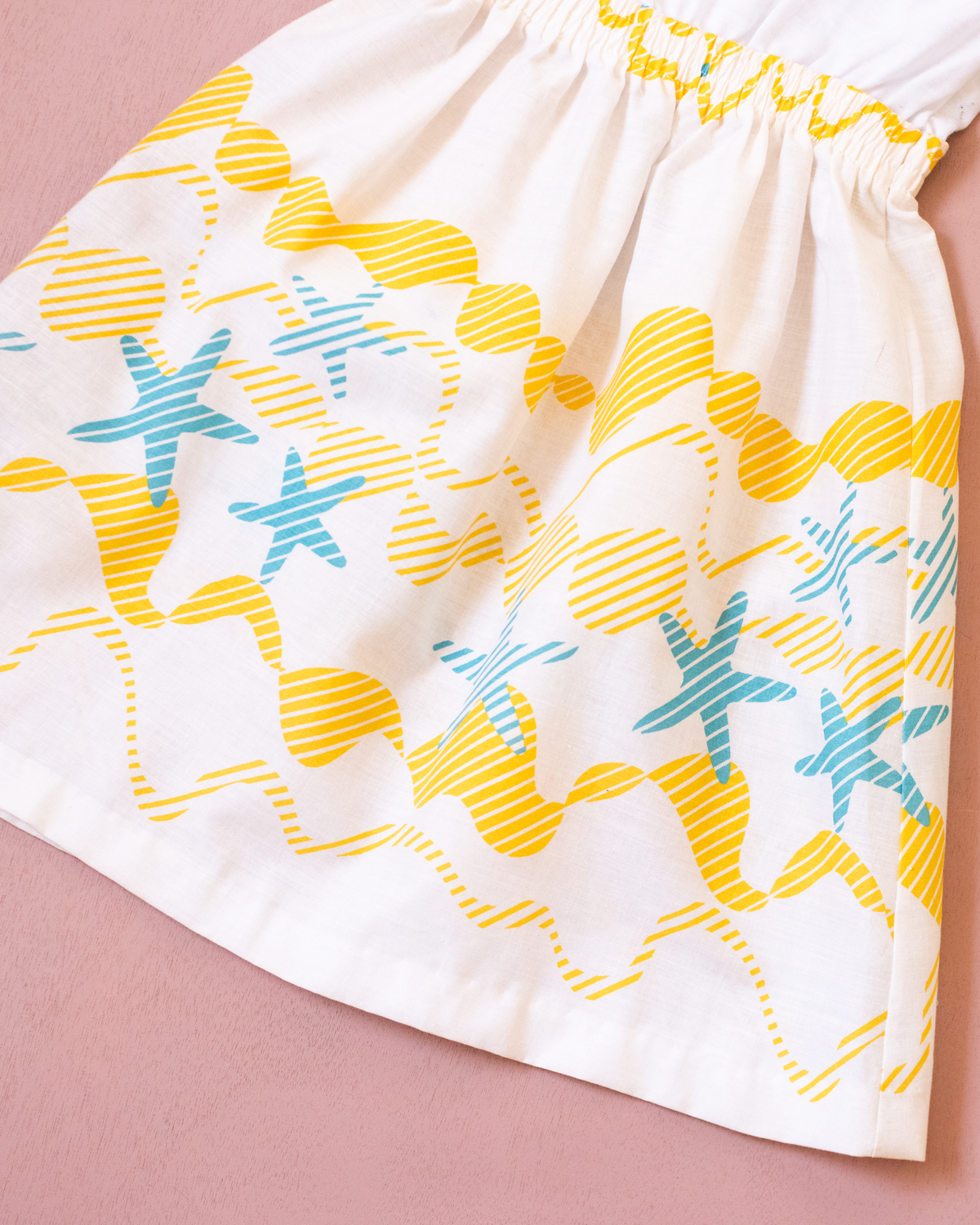 White dress from Spain with a print of waves and starfish | 10-11 years