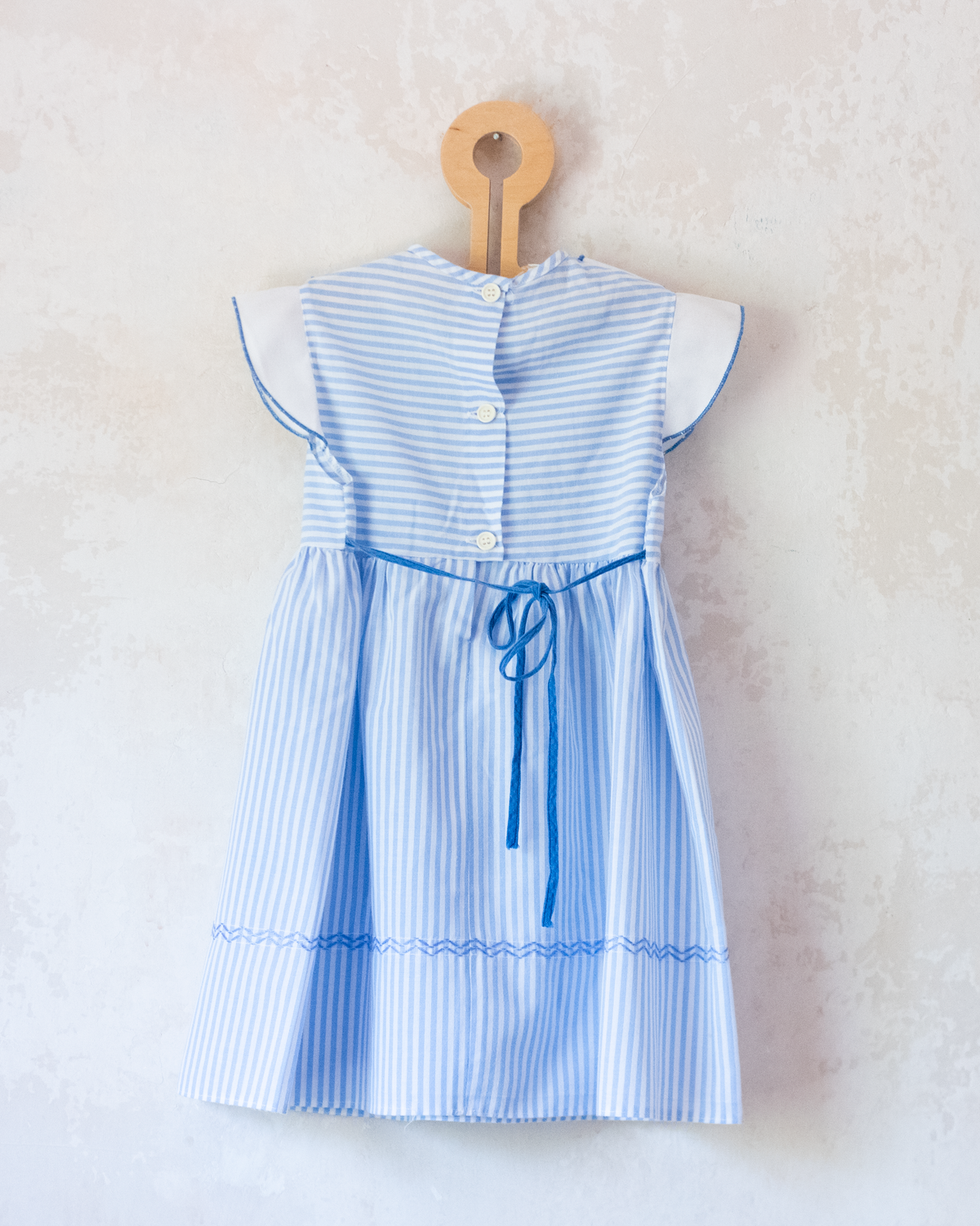 Striped dress with embroidered sailboat | 2-3 years