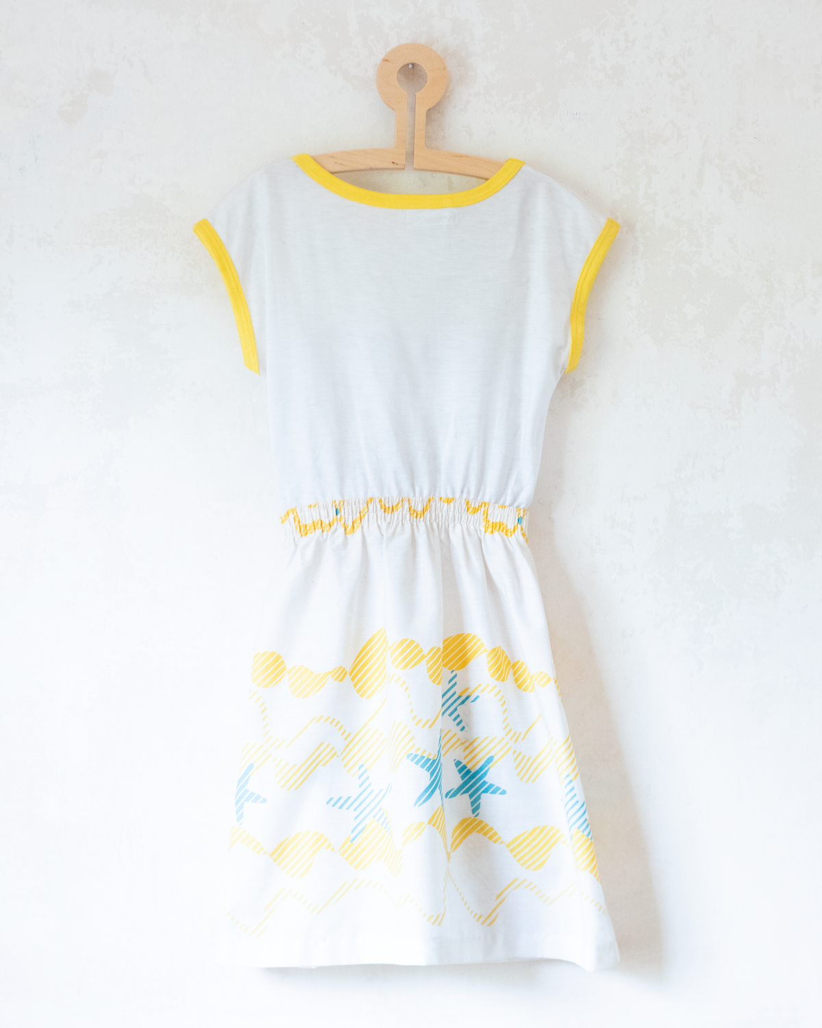 White dress from Spain with a print of waves and starfish | 10-11 years