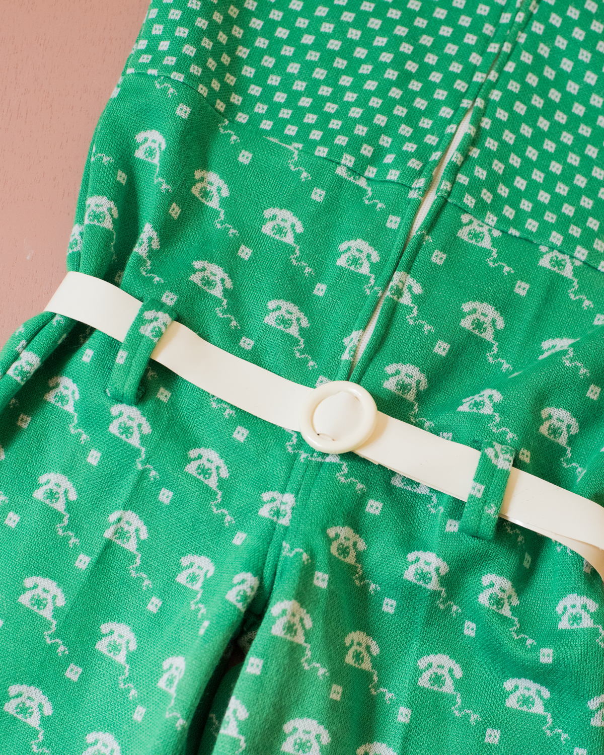 Green 70s jumpsuit with a rotary phone | 3-4 years