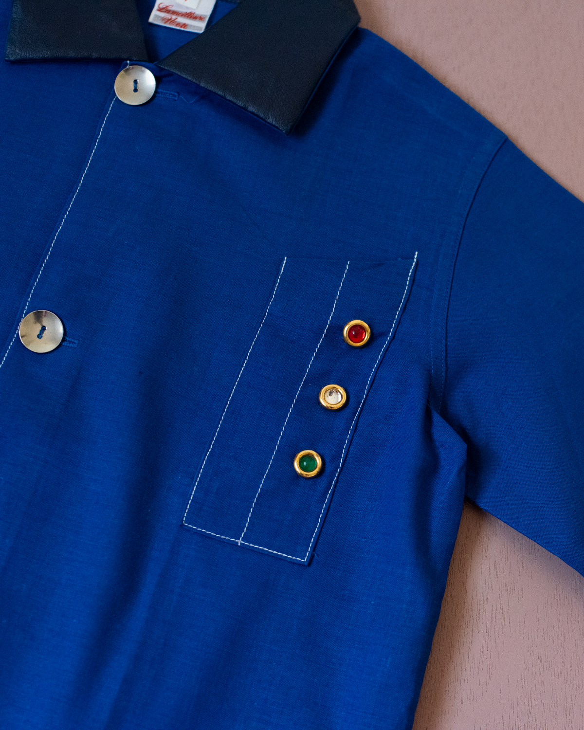 Blue shirt with embroidery of a boy riding a bicycle | French dead stock from the seventies | 4-5 years