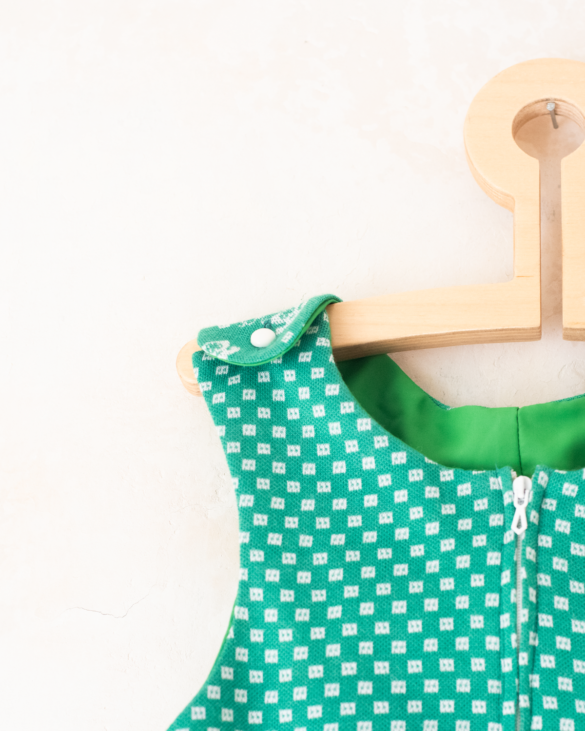 Green 70s jumpsuit with a rotary phone | 3-4 years