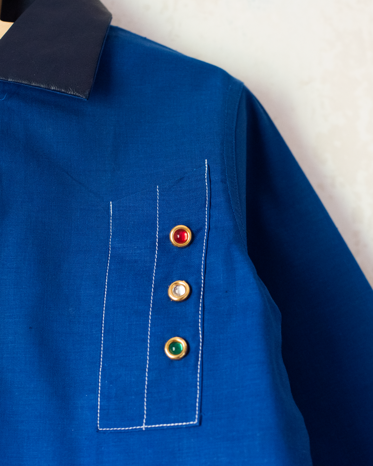 Blue shirt with embroidery of a boy riding a bicycle | French dead stock from the seventies | 4-5 years