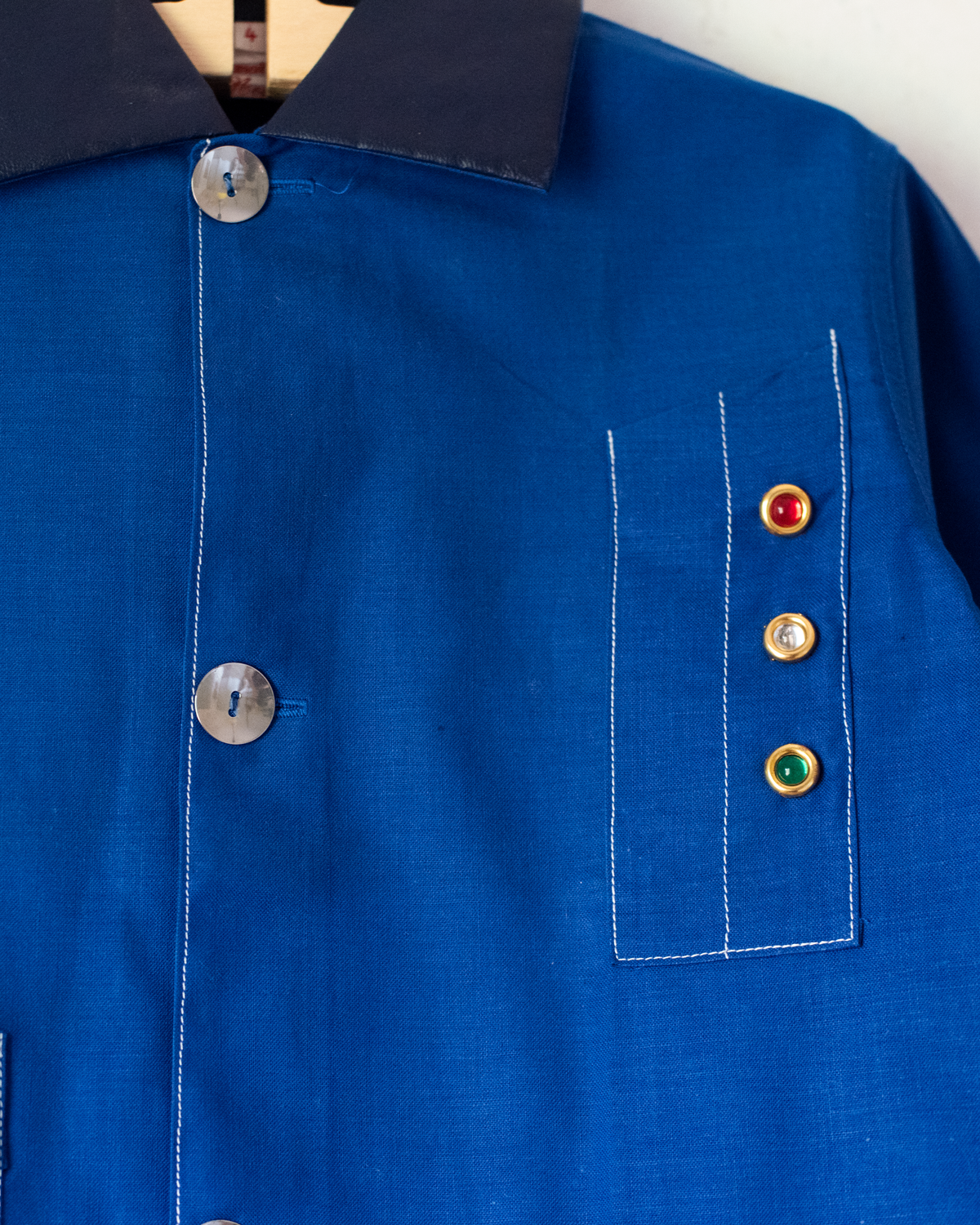 Blue shirt with embroidery of a boy riding a bicycle | French dead stock from the seventies | 7-8 years