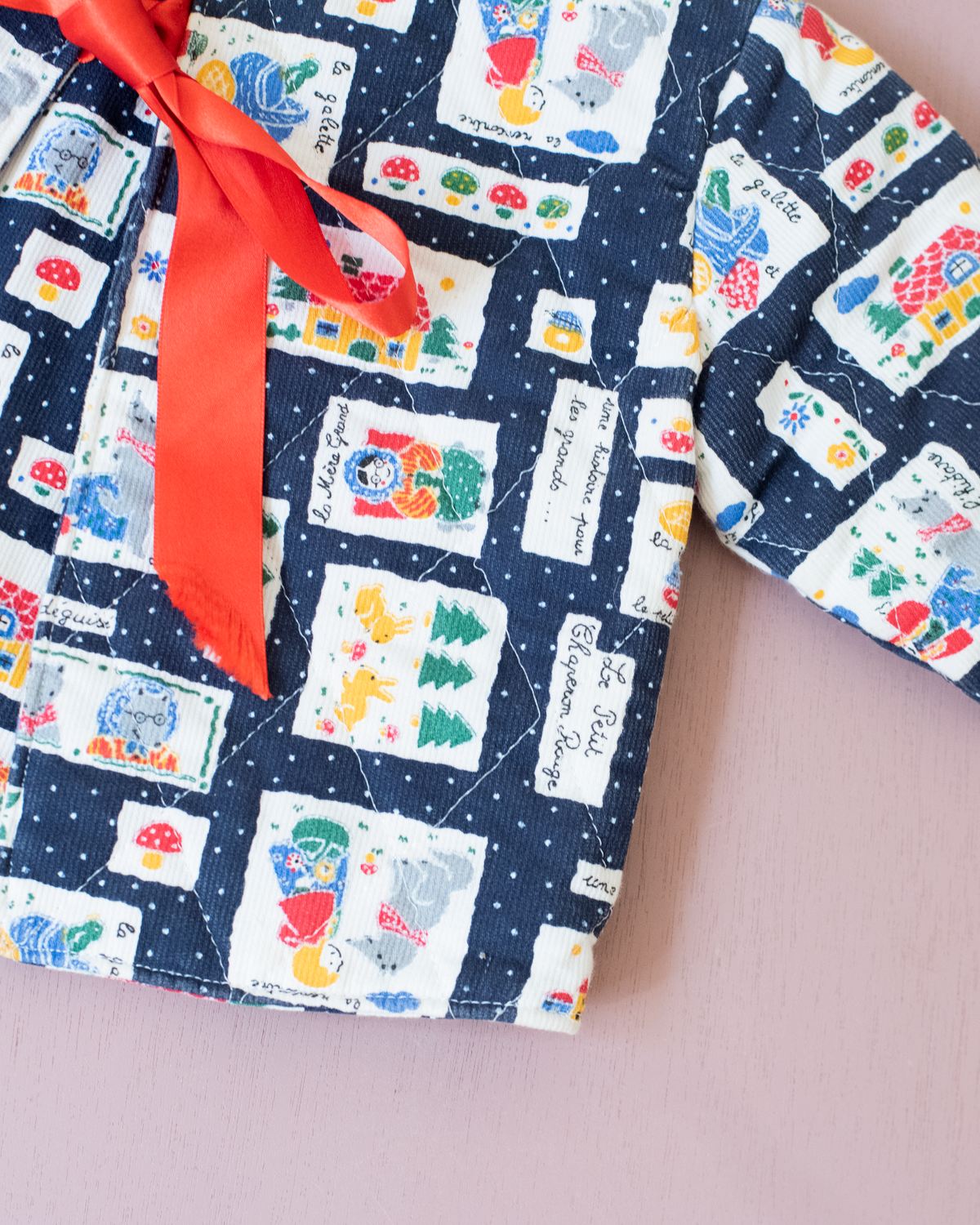 Blue top with nostalgic prints and bow tie | 9-12 months