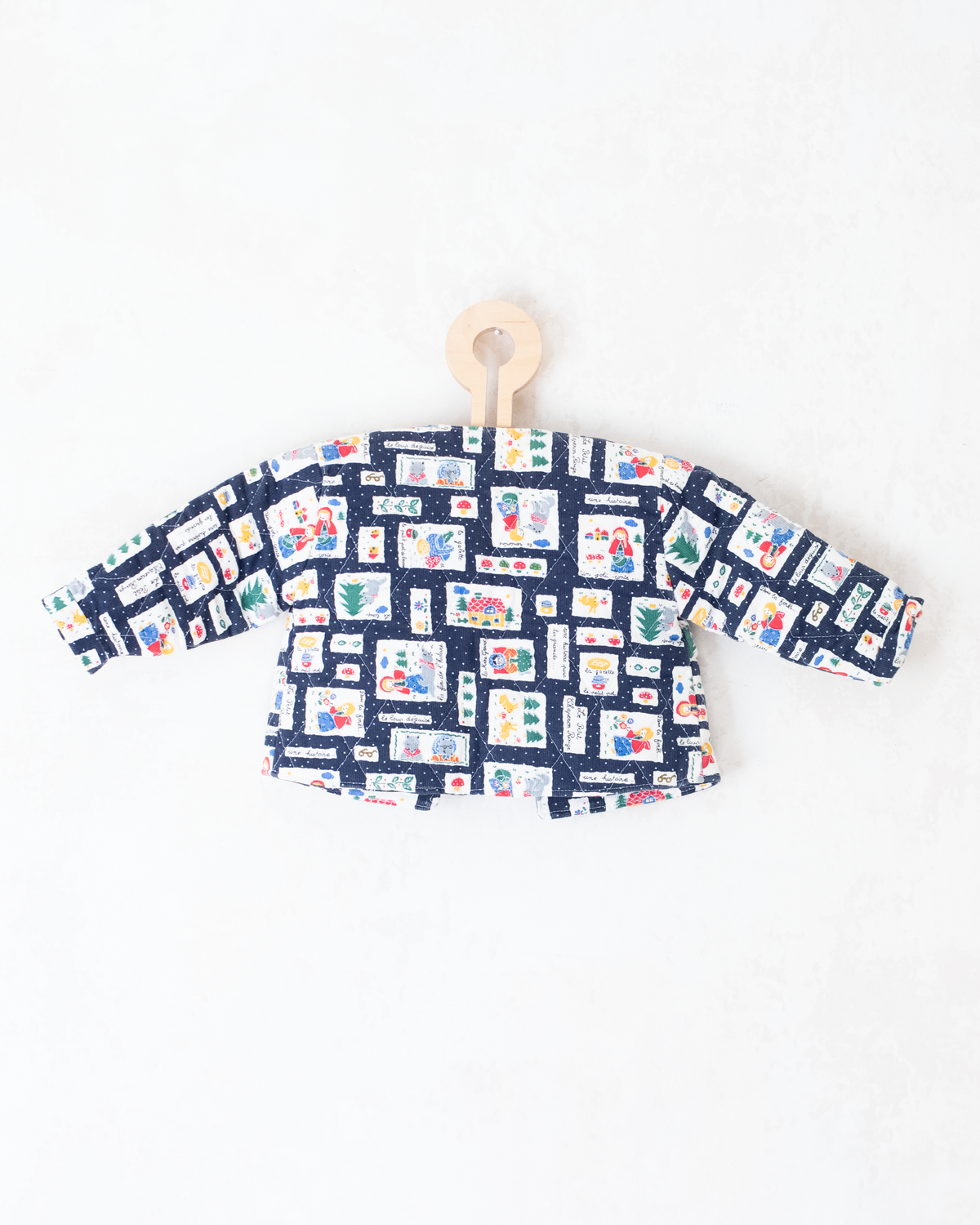 Blue top with nostalgic prints and bow tie | 9-12 months