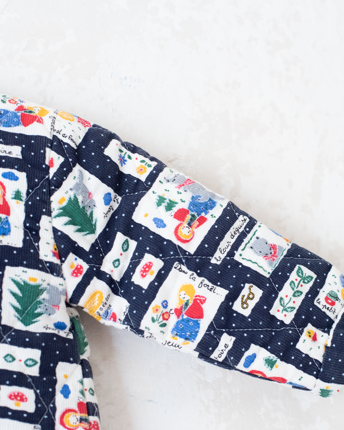 Blue top with nostalgic prints and bow tie | 9-12 months